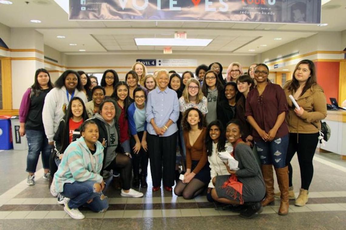 Students gather around poet Nikki Giovanni during HBW’s 2017 "An Evening with Nikki Giovanni" event.