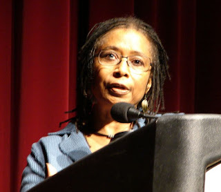 Alice Walker speaking in front of a podium.