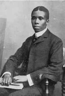 Black and white portrait of Paul Laurence Dunbar.