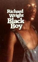 "A black boy in a grey sweatshirt with the caption 'Richard Wright Black Boy'"