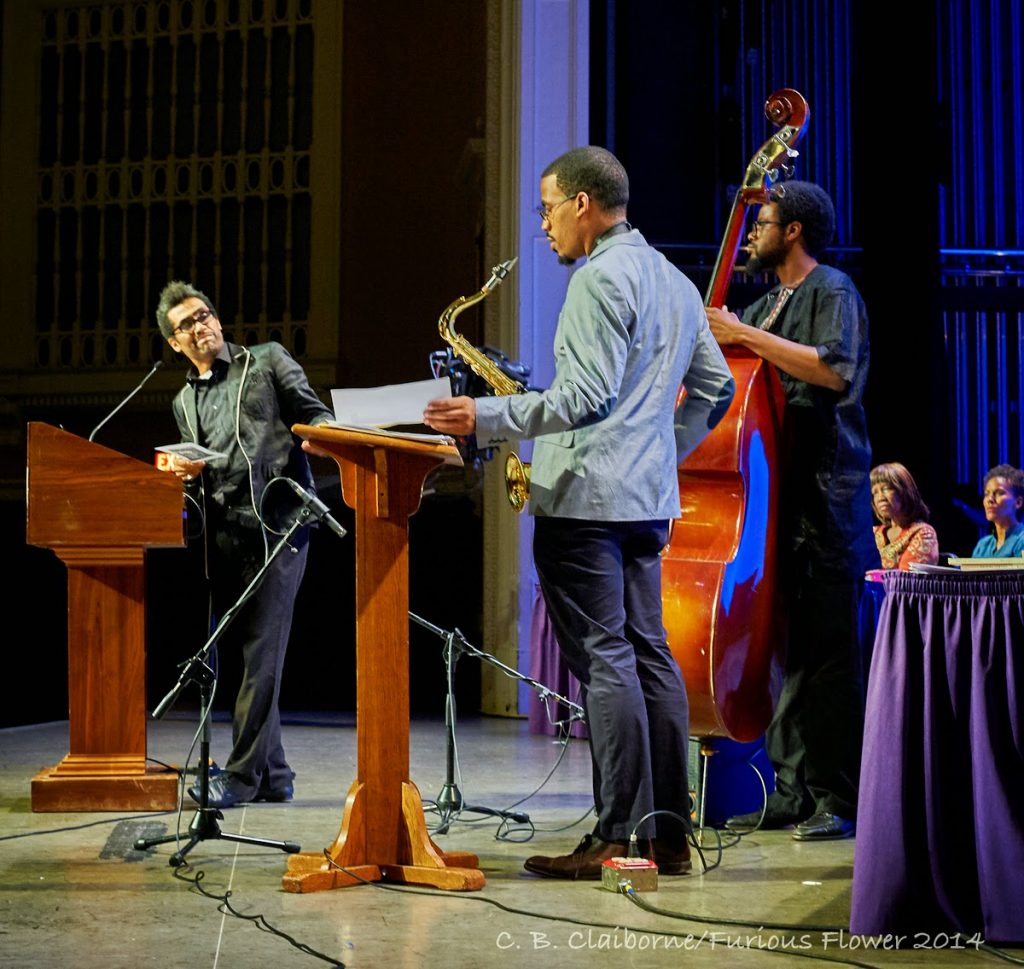 "# musicians playing instruments on a stage"