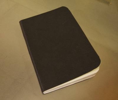 "A book with a plain black cover"