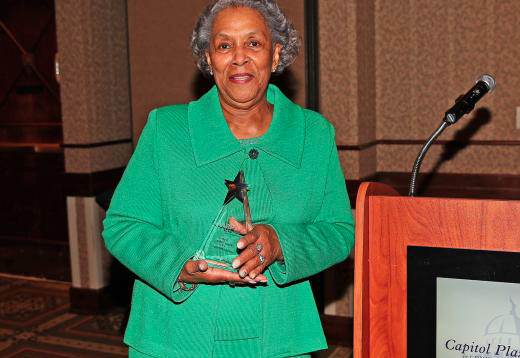 "Ann B. Garvin receiving an award"