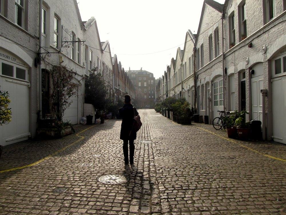 Crystal Bradshaw walking down a brick road in England