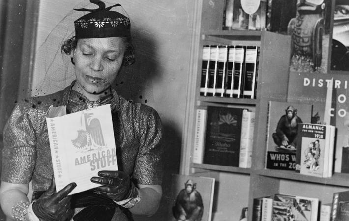 "Zora Neale Hurston reading the book 'American Stuff'"