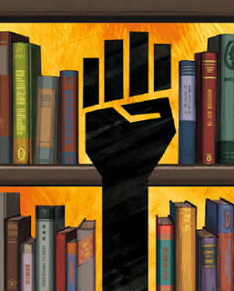 "A stack of books behind a black raised hand"