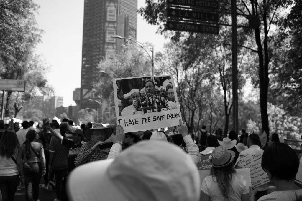 People protesting on the streets of Mexico against the government and Trump.