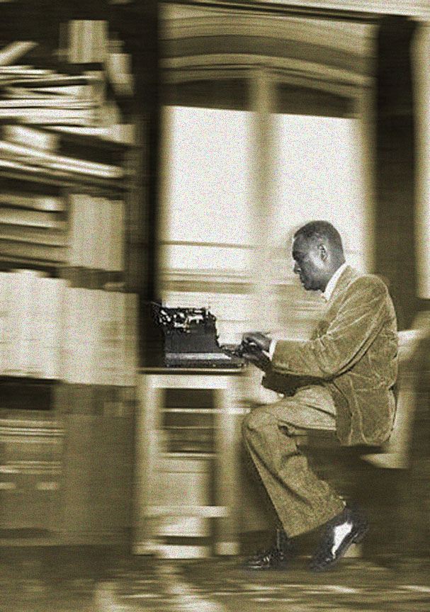 "A man using a typewriter"