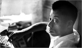 "Black and white image of James Baldwin"