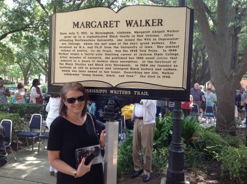 "Dr. Carolyn Brown author of  “Song of My Life: A Biography of Margaret Walker” and “A Daring Life: A Biography of Eudora Welty ” in front of Margaret Walker marker."