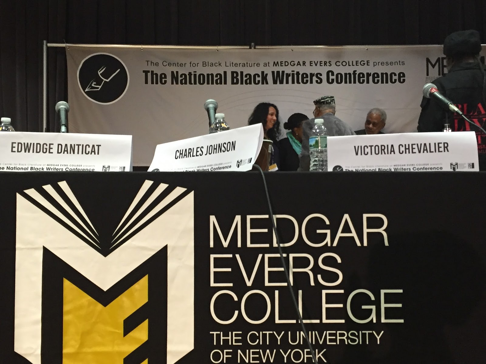 The National Black Writers Conference with three name tags of Edwidge Danticat, Charles Johnson, and Victoria Chevalier