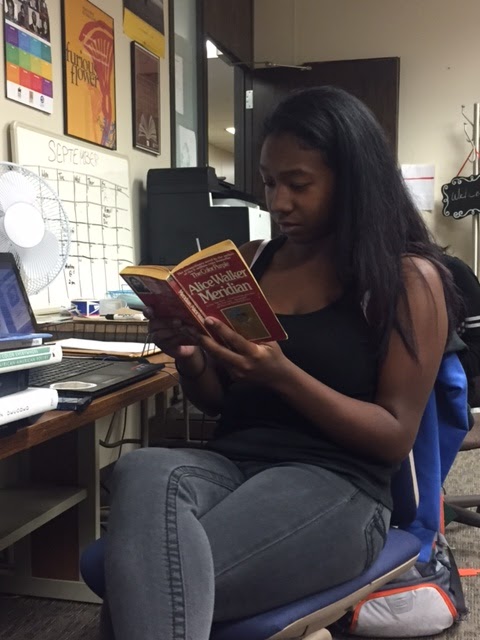 Dominique Walker reading a book