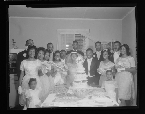 "A black and white photograph of a family wedding"