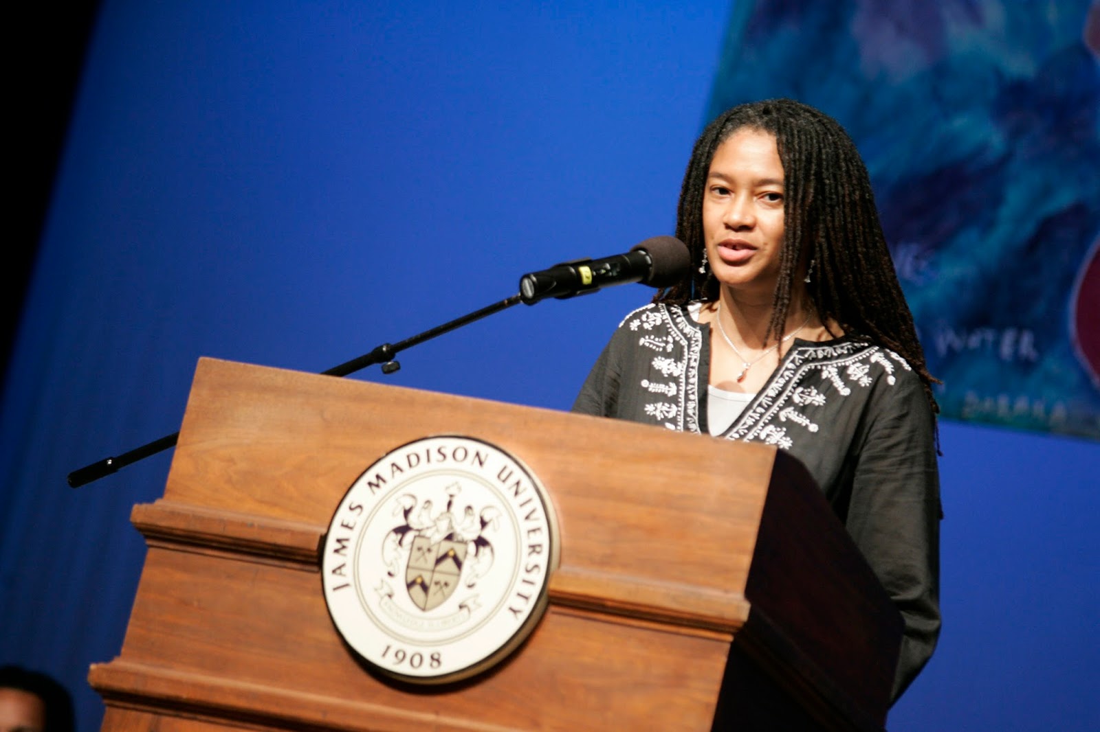 "Sharan Strange speaking on a podium"